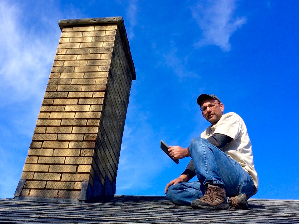 John Lawson of Assured Home Inspections inspecting the roof of a single-family home in Northern Kentucky